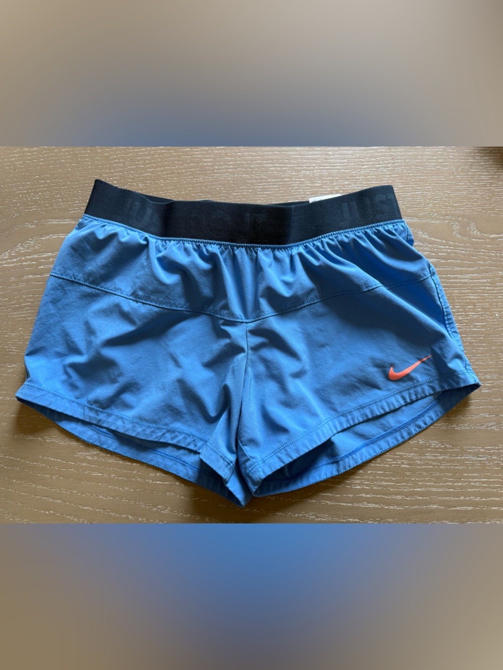 Nike Blue Women's Athletic Shorts with Black Waistband and Orange Swoosh small